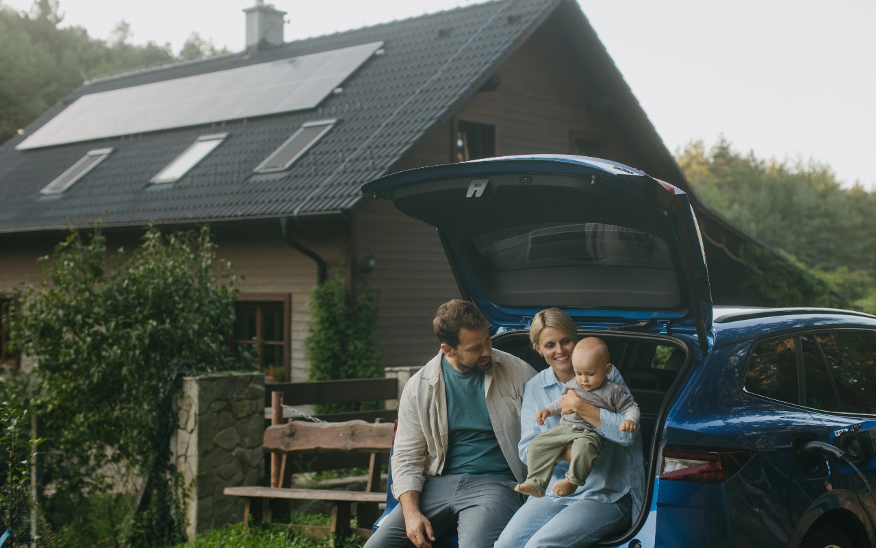 happy family driving a modern electric car on a sunny highway, safety concept, lifestyle photography, high resolution